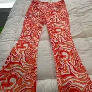 Long flared orange and white pants